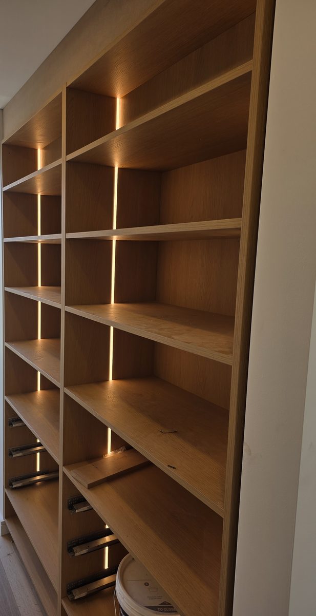 Wardrobe shelving with vertical LED strips in each bay, Picnic Point duplex